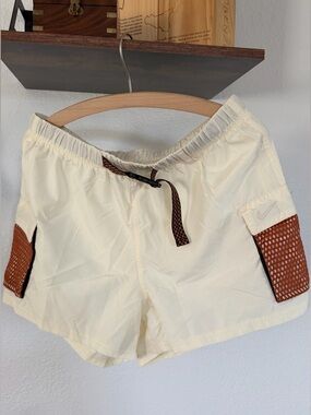 NWT Nike Women's Cream Athletic Shorts with Pockets and Mesh Accents